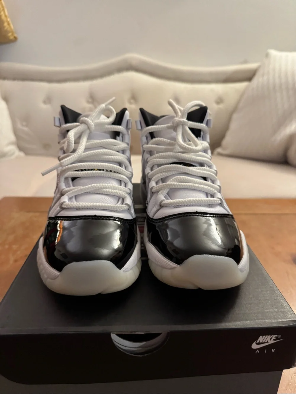 Air Jordan 11 Retro (GS) Big Kid’s Sneakers in White and Patent Black
